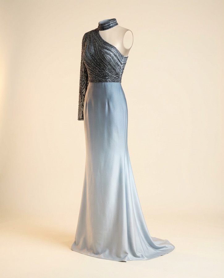 Caliente by Oscar B — black sequin top with pale blue flared pants
